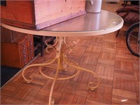 Round metal patio table with glass top,
