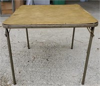 Folding square table. Stands about 2 1/2 ft tall.