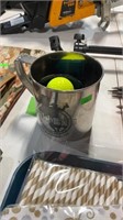 Cup with golf balls