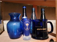 Cobalt vase, shot glass, mug, bottles