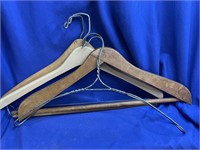 4 Coat Hangers.  Two are wooden