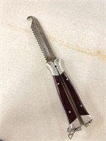Folding hunting knife with saw, blade and gutting