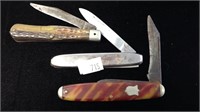 Three vintage pocket knives one with damage and