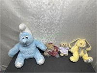 Large stuffed smurf, and bears and a rabbit