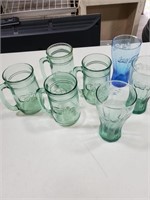 Coca-Cola glasses, four 5 1/2in mugs and three