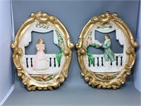 pair of oval chalkware wall ornaments