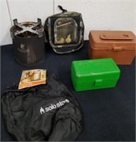 Ammo boxes, camo bag, and a Pendleton Whiskey