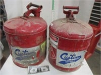 Two metal gas cans