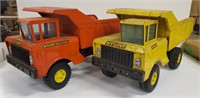 Pair of Nylint dumptruck toys, red one is