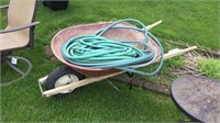 Wheel barrel and garden hose