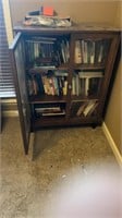 Glass Front Cabinet Full of Books