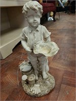 sculpture of child with hat in hand for garden