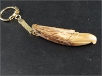 Fossilized ivory key chain carved into an eagle's
