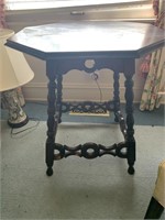 Octagon shaped table with some damage to base