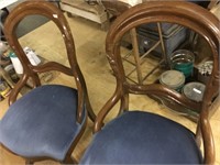 2 padded wood framed chairs
