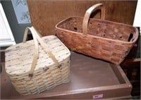 2 antique baskets. Some damage. Length of longest: