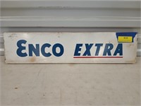 Emco Extra metal sign mounted on a piece of wood