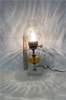 Electric oil style lamp, clear & orange in color