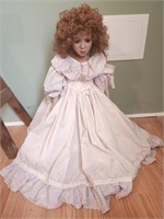 24" vintage doll with red curly hair , brown eyes