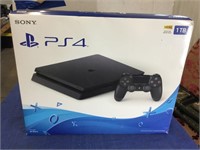 Sony PlayStation 4, model CUH-2215B, in box