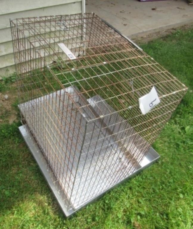 Beacon pet cage. Measures: 16" H x 24" W x 24" D.