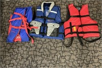 3 life jackets 1 is a stearns adult XL other 2 are