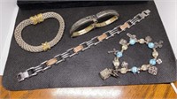 Group of unmarked bracelets, charms