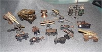 Replica brass items including cannons, train