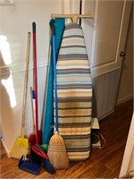 Ironing board and brooms