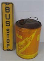 Bus stop sign and metal gas can.