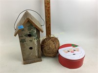 Stenciled wood birdhouse.  Large ball of twine.