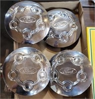 SET OF FOUR FORD SILVER-COLORED HUB CAPS