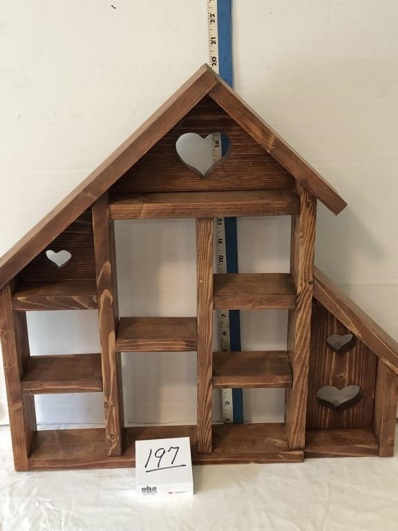 Shelves in shape of a barn made by Ed