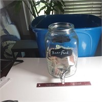 Jar with Canadian tire money