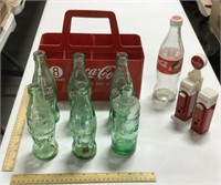 7 Coca-Cola glass bottles w/ metal container &