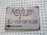 TIN ASYLUM ENTRANCE SIGN