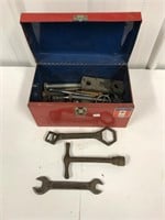 Small tool box with antique wrenches.  Misc bolts