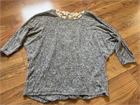 C10) Woman’s shirt size medium.