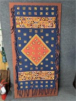 ANTIQUE RUG ATTACHED TO WALL HANGER