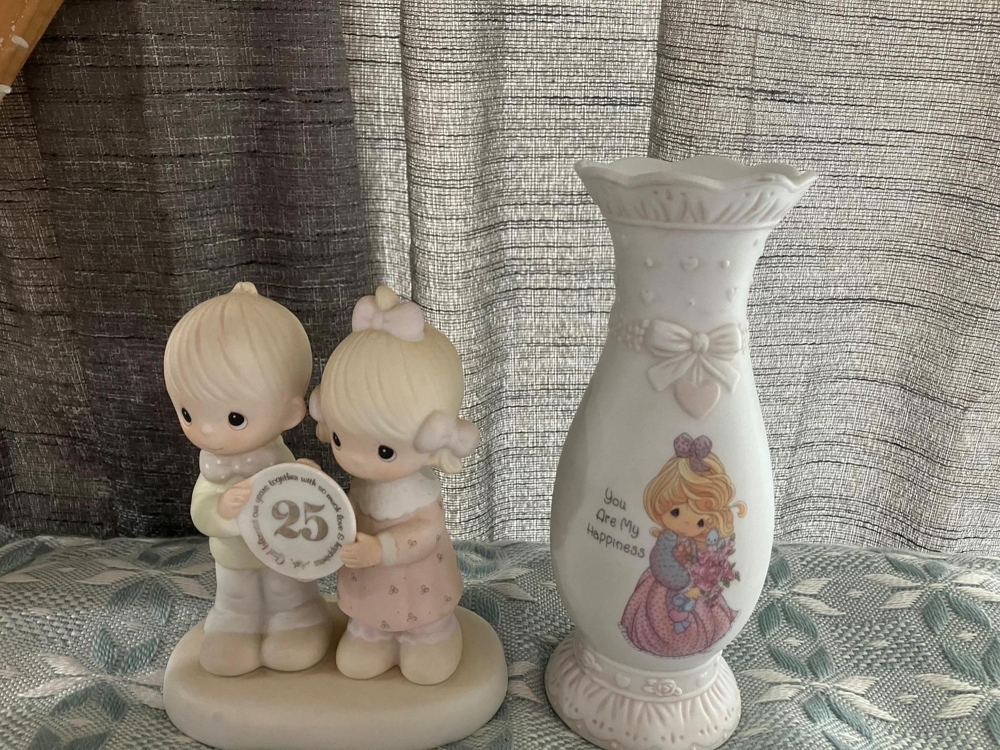Precious moments figure and vase