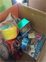 Box full of Christmas tins and toys
