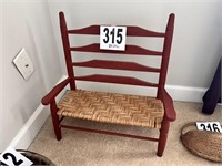 Red wooden doll bench