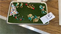 Christmas pin and 5 sets of clip earrings