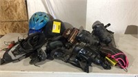 Tote of rollerblades, helmets, mitts and dremmel