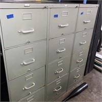 3 green file cabinets
