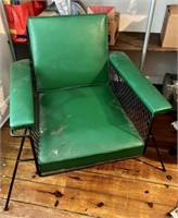 2 green vinyl and black wrought iron chairs