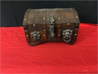 Wooden treasure chest with plastic coins and