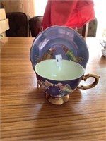 Japan handpainted raised birds cup and saucer