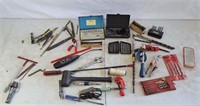 assortment of drills, socket set, screw driver