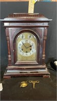vintage clock with key and pendulum